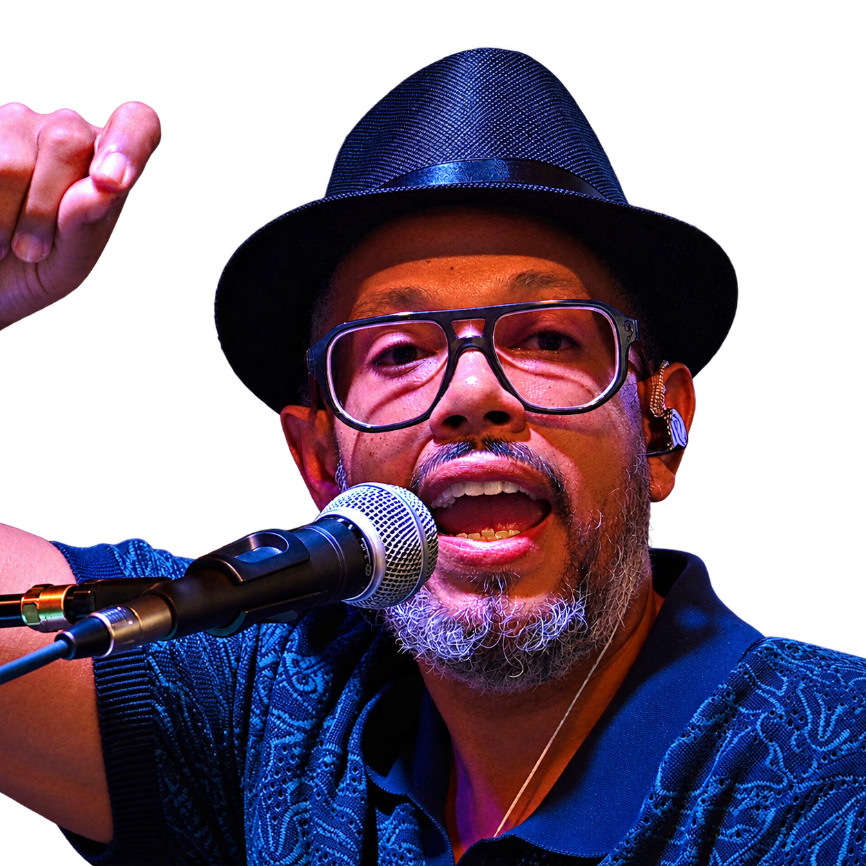 LytSkyn singing into a microphone, wearing a black hat and glasses